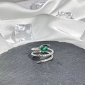 Detailed macro of a silver snake ring with green pear-shaped gemstone and scale texture - Style 13 Adjustable Ring