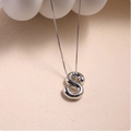 Macro detail of silver balloon style S letter pendant with polished mirror finish surface - Silver (With Necklace) S