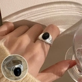 Vintage silver adjustable ring featuring a minimalist black oval stone and spiral texture - Black Agate Spiral Texture