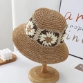 Light brown woven straw bucket hat featuring delicate crochet flower patterns for women - One Size / Khaki