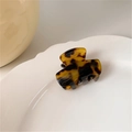 Mini cellulose acetate hair claw clip with classic tortoiseshell pattern on white plate - Dark Leopard