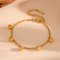 Detailed shot of golden stainless steel bracelet with five beads and extension chain - Gold Steel Ball Bracelet