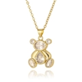 Dettaglio macro di una collana con ciondolo a forma di orsetto dorato e zirconi lucidi - Bianco