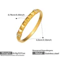 Detail view of 18k gold plated stainless steel bangle with pyramid studs and white zircons - Rivet Pyramid Style (Z034) / Gold