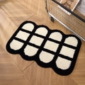 Thick black and white grid bath mat with wavy edges on a wooden floor - 50x80cm / Cheese Plaid