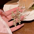 Elegant long gold leaf tassel earrings with brushed texture for women in retro style - A1879 Gold