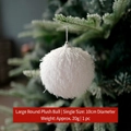 White 10cm fuzzy faux fur Christmas ball ornament hanging on a green Xmas tree branch - Plush Ball Round White 10CM