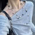 Detail of multi-layered grey pearl necklace with mixed beads on a grey sweater - Black and White Pearl Splicing Necklace