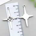 Silver star and cross alloy pendants shown with ruler measurements for scale - Four-Pointed Star Cross (22341) / 1 Piece (29x18mm) / Antique Silver