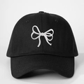 Close-up of high-quality white bow embroidery on black cotton twill baseball cap - Black