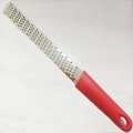 Handheld stainless steel zester and cheese grater with a vibrant red ergonomic handle - Fine Teeth Red Thin