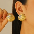 Detailed close-up of gold shell earrings with silver starfish and small pearls on ears - Shell Starfish Stud Earrings (5010)