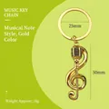 Goldener Musik-Schlüsselanhänger mit Violinschlüssel- und Mikrofon-Anhänger, poliert - Neue Musiknote / Gold