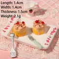 Macro view of miniature resin cakes with cherry detail on a white tray, 1.4x1.4cm size - Cherry Cake