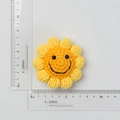 Detailed view of hand-crocheted sunflower keychain showing 5.5cm size with a ruler - 5-Ring Smiley Sunflower