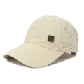 Detail of beige quick-dry baseball cap with laser-cut breathability holes and metal badge - Adjustable / Off White