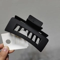 Detail of a black matte rectangular hollow claw clip with a Made in Korea tag - Matte Black