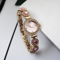 Elegant gold quartz bracelet watch for women with pink dial and rhinestone encrusted bezel - Pink