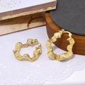 Golden wave-shaped hoop earrings with textured metal finish on minimalist wood background - Irregular Wavy Texture Style (ZYN-DME316G-1)