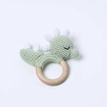 Handmade crochet baby rattle with a green dinosaur figure on a natural wooden ring - New Green Dinosaur