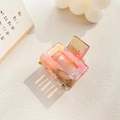 Pink and yellow gradient acetate square hair claw clip for high ponytail on white table - Metallic Red