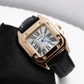 Macro view of square gold case with exposed screws and white Roman numeral dial - Black Strap White Dial