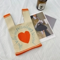 Chic knit handbag in cream with orange heart and blue text on white fabric - Orange (Heart)