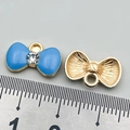 Blue enamel bowknot pendant with crystal center and golden back, 2.5cm width - Lake Blue Rhinestone Bowknot