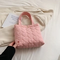 Pink heart quilted tote bag with metallic snap closure and lightweight puffy texture - Pink