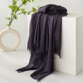 Deep purple cotton linen scarf with elegant fringe trim draped over a minimal white display - Wisteria Purple