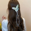 Green butterfly hair claw with pearls and long flowing tassels shown on hair - 57# Duckbill Clip - Green - Light Green Long Tassel Butterfly Single