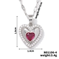 Macro shot of heart pendant with red stone, including size specs 1.9x1.4cm and weight 3.4g - Silver with Red (N01106-4)