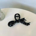 Détail d'une grande pince à cheveux nœud avec un motif à pois noirs et blancs élégant - Nœud de Ruban Noir / Noir