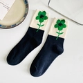 Mid-calf cotton socks in cream and navy blue with green flower patterns and ruffle cuffs - One Size / Black