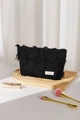 Close-up of black frayed linen makeup bag with H&R brand label and premium zipper detail - Black Large