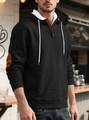 Detail of black diamond-quilted hoodie with brown elbow patches and buttoned neckline - S / Tops / Black