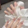 Detail of long pointed press-on nails with nude gradient, pearls, and silver lines - By1676 Jade Bead Necklace / Glue Type