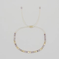 Handmade beaded bracelet featuring purple faceted stones and gold accents with adjustable cord - Purple