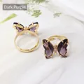 Adjustable golden butterfly ring set featuring deep purple crystal wing details - Dark Purple