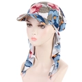 Detail of colorful floral print headscarf hat with visor on a mannequin head - White Floral