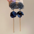 Detail of floral petal earrings with layered resin petals and long gold metal tassels - Black Flower Tassel Style / Black
