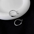 Macro shot of silver geometric earrings with irregular metal hoops on a ceramic tray - 17# Silver Needle-Silver-Mirror Irregular Loop (Round)