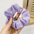 Detail of purple ruched oversized scrunchie hair tie held against a minimalist background - 7# Purple Grid