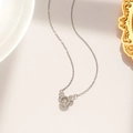 Macro detail of dancing Mickey pendant with silver necklace and sparkling zircon stones - Floating Mickey Style (8933) / Silver