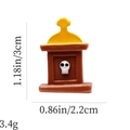 Detailed view of Halloween tombstone figurine with skull and dimensions 3cm by 2.2cm - Brown Tombstone