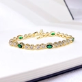 Elegante gouden armband met groene ovale stenen en witte zirkonia accenten - Nano Groene Edelsteen & Zirconia Verguld (ca. 16,3 cm + Verlengstuk)