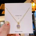 Collier élégant en acier titane doré doté d'un pendentif en cristal rond étincelant - Collier Zirconium Rond Doré