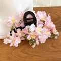Close-up of elegant pink fabric flower hair clip on a warm wooden surface background - Hair Claw Pink / Pink