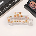 Detail of a transparent Halloween hair claw clip with orange pumpkin and BOO patterns - 8.5cm Transparent Square - Hat Wearing Pumpkin