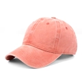 Detail view of washed coral pink cotton twill baseball cap with vintage distressed texture - Adjustable / Orange Red